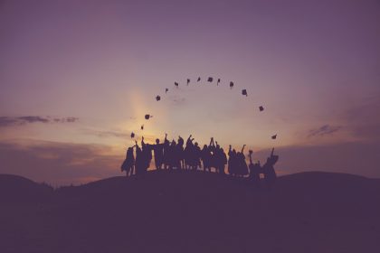 Graduates throwing their caps