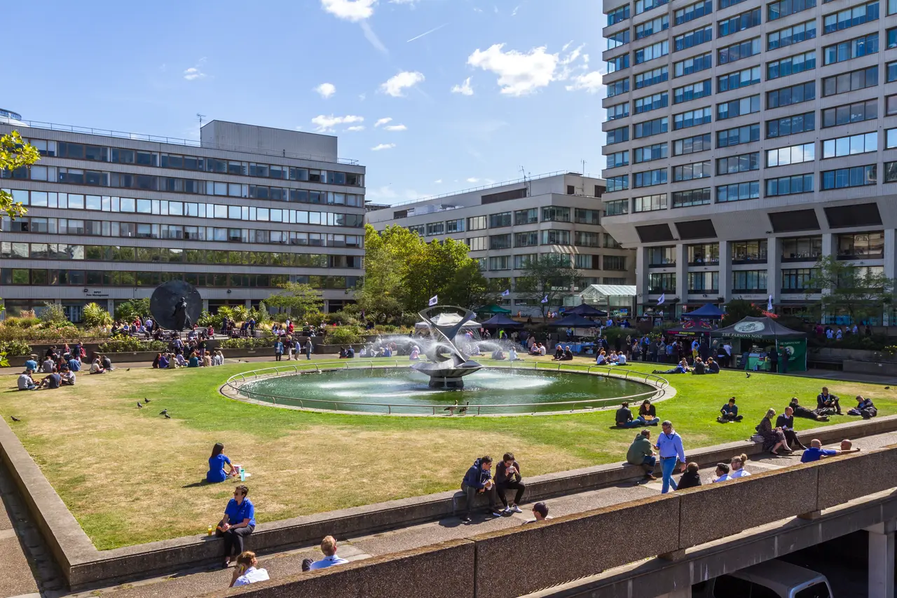 Students enjoying campus courtyard on a sunny day